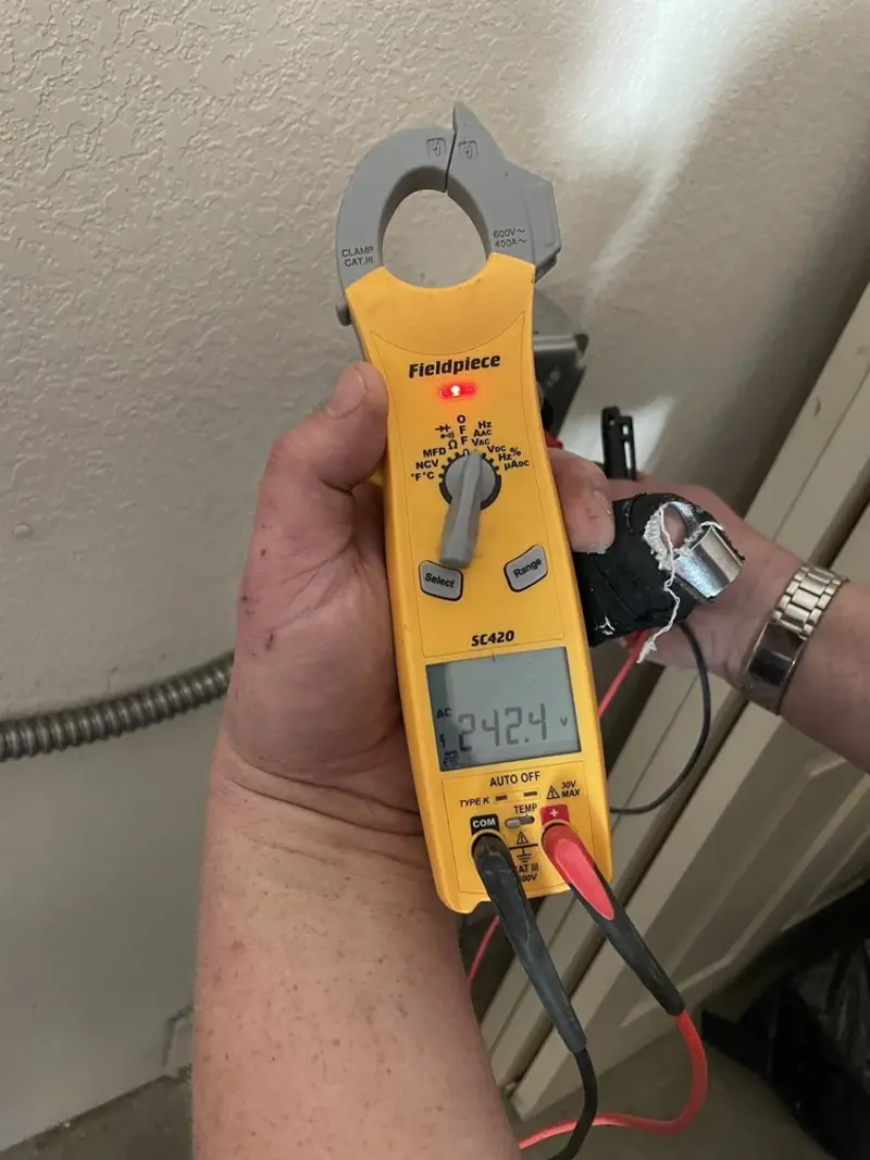 Voltage testing with clamp meter during Aluminum Wiring Replacement in Blackman